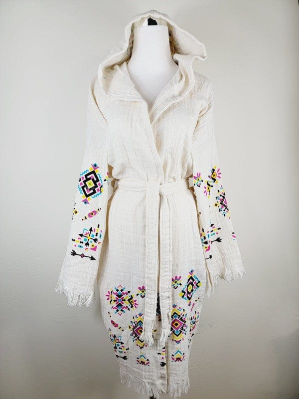 Bohemian white hooded kimono with colorful embroidered geometric patterns, belted waist, and fringed edges.