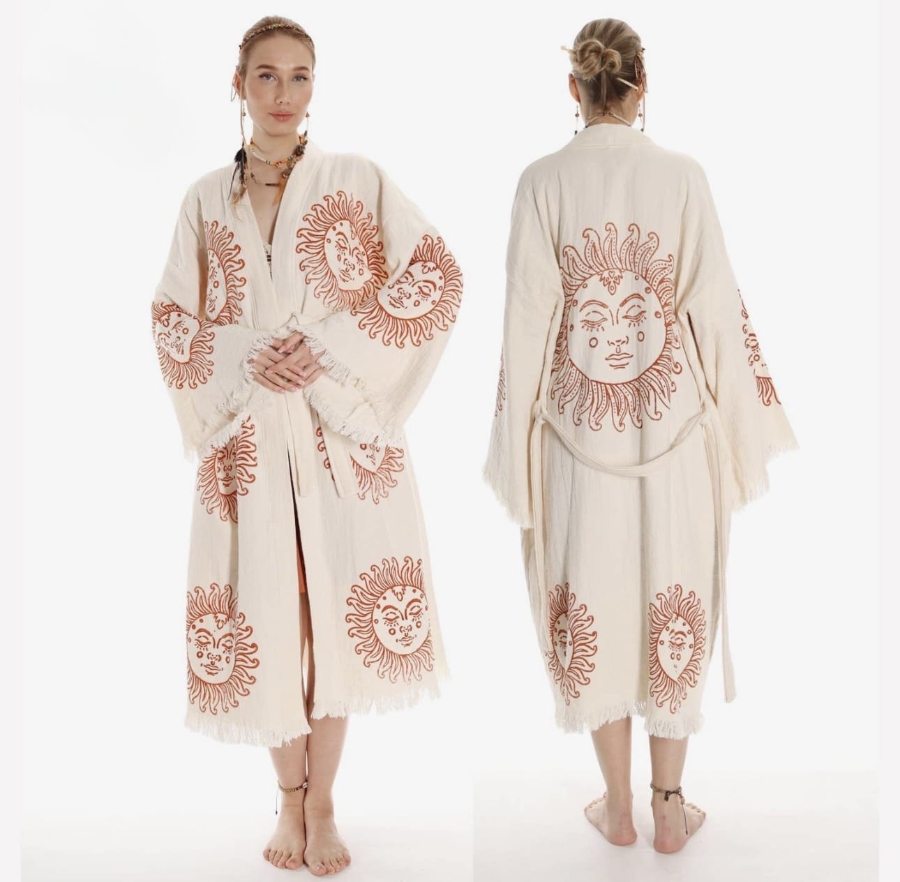 Woman wearing a cream-colored robe with red sun designs on a white background