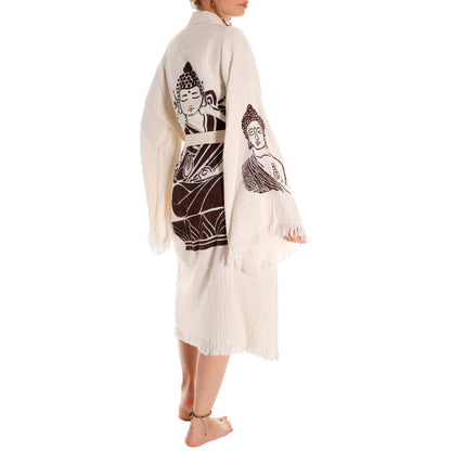 Person wearing a cream-colored kimono with Buddha illustrations on a white background